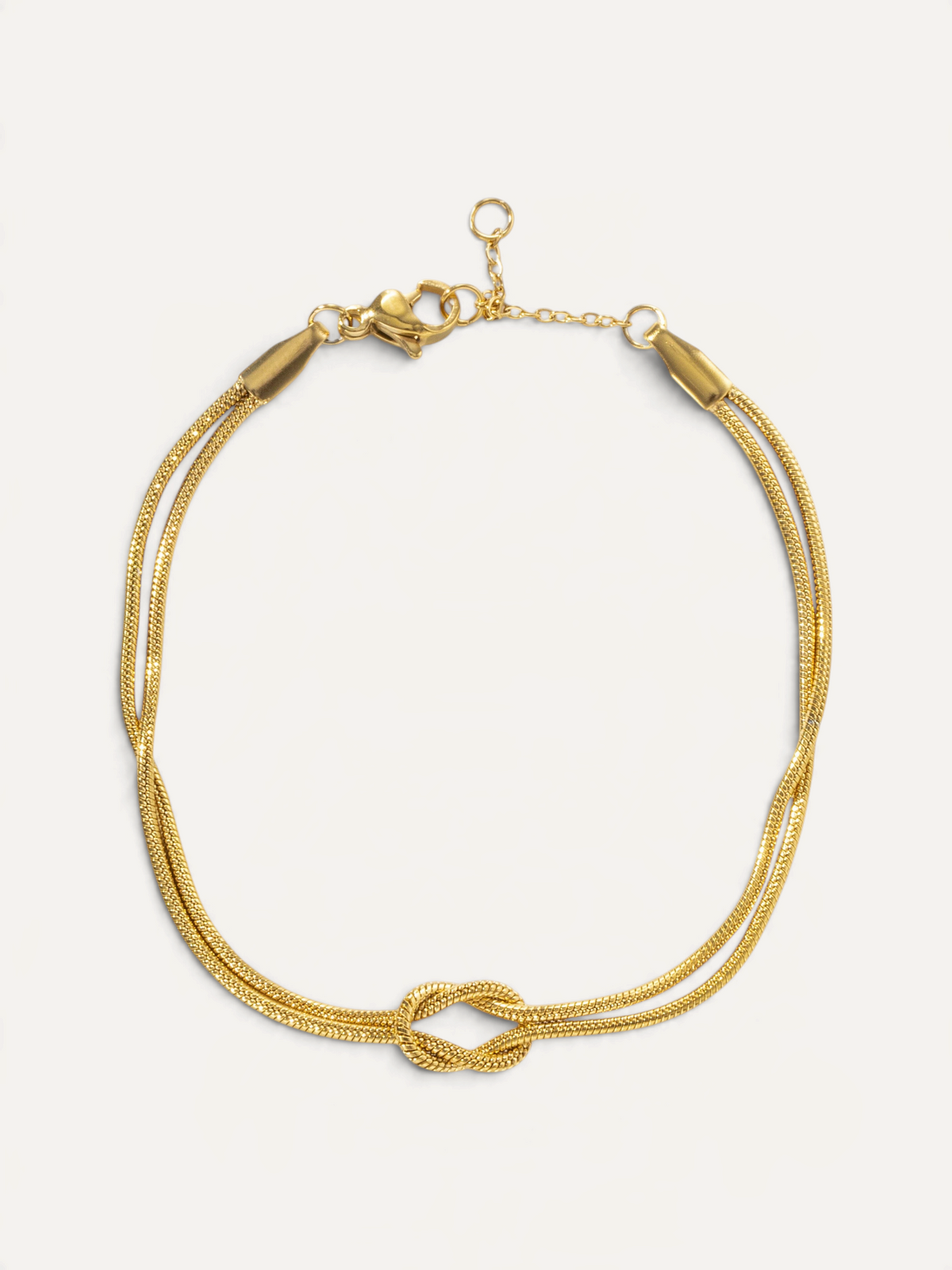 CÉLOIR Saphera Armband aus goldfarbenem Edelstahl mit filigranem Kettendesign und dekorativem Knoten-Element