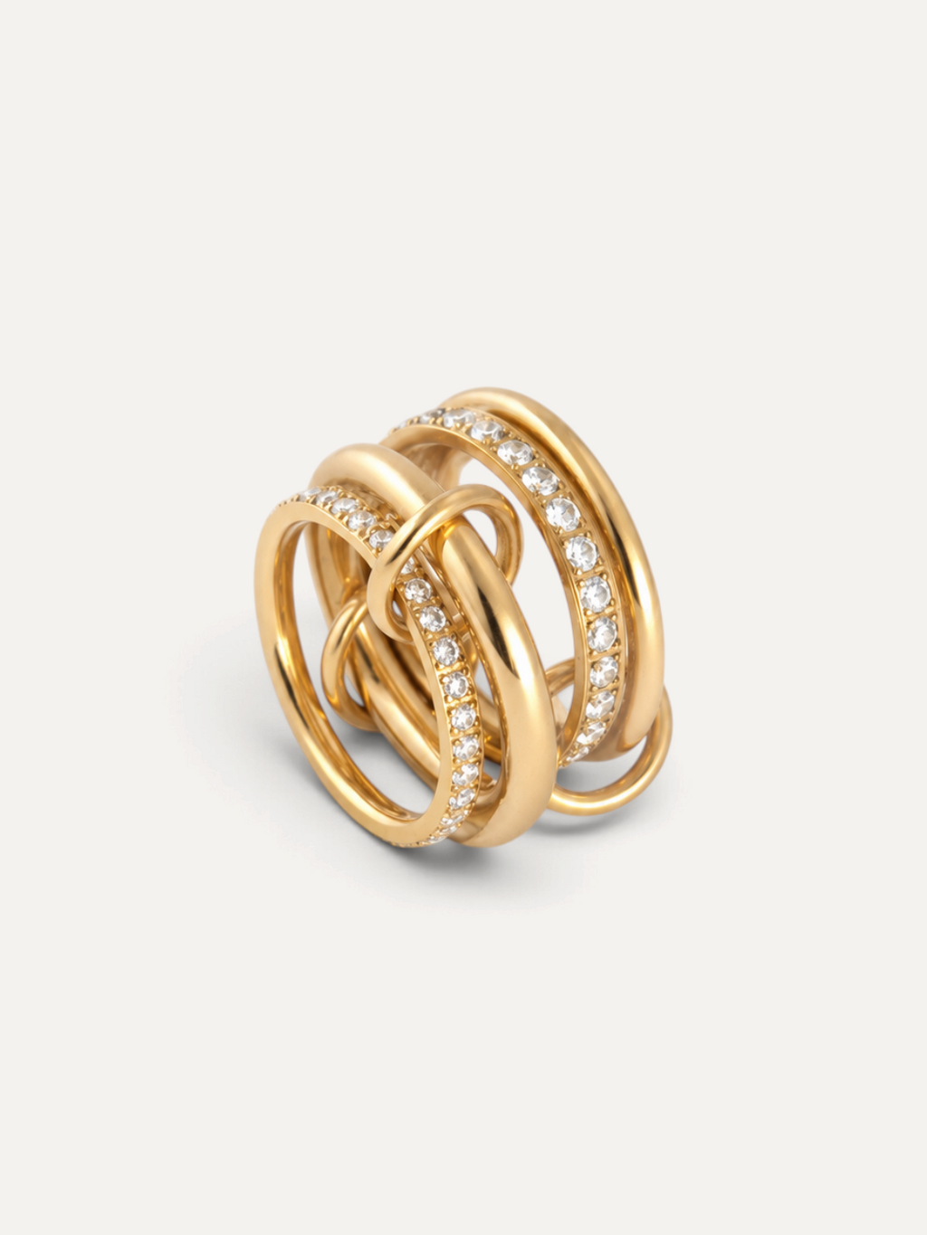 CÉLOIR VERMONT Ring aus goldfarbenem Edelstahl mit ineinander verschlungenen Reifen und funkelnden Zirkonia-Steinen